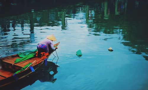 Woman in boat on lake