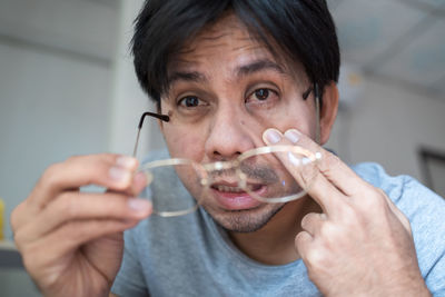 Portrait of man drinking glasses