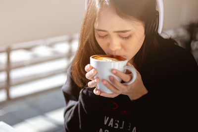 Close-up of woman drinking coffee