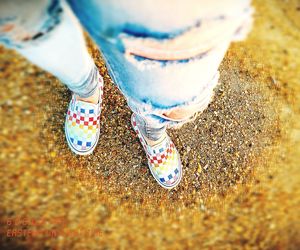 Low section of woman standing on ground