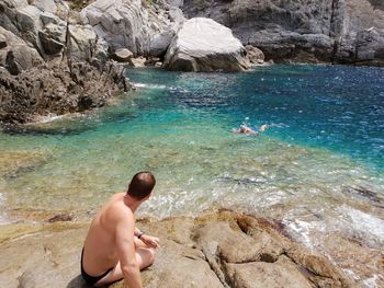 Man swimming in sea