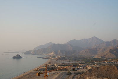 Scenic view of sea with mountains in background