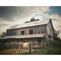 Built structure against cloudy sky