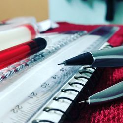 Close-up of school supplies on files over table