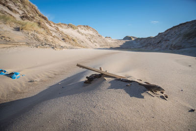 Scenic view of beach against clear sky