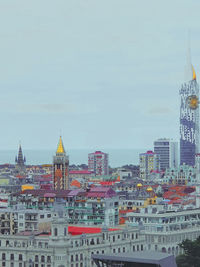 Buildings in city against sky