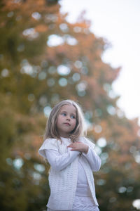 Beautiful little child girl walking in a park