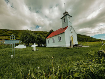 House on field against sky