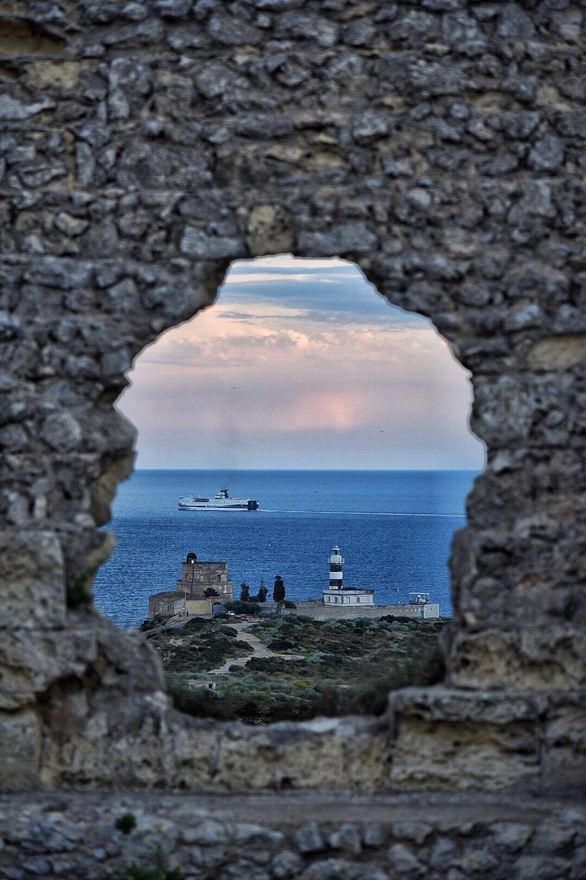 SCENIC VIEW OF SEA SEEN THROUGH ARCH