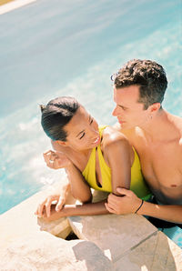 Portrait of young woman swimming in sea