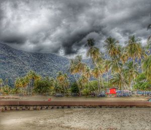 Scenic view of sea against cloudy sky