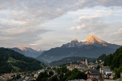 Panoramic view of buildings and mountains against sky