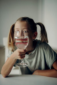 Portrait of woman holding wineglass