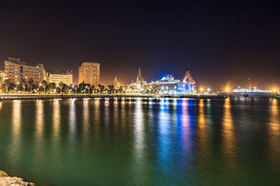 Illuminated buildings at waterfront