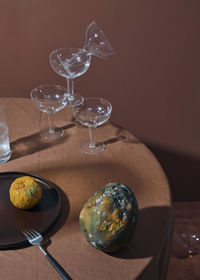 Close-up of wine glasses on table