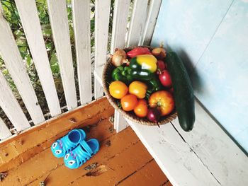 High angle view of vegetables in container at porch