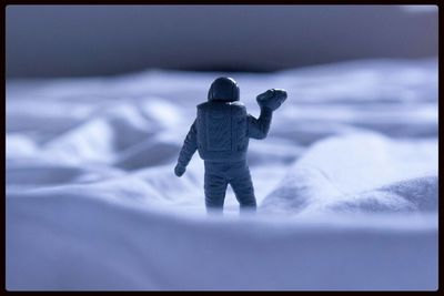 Full length of woman standing on bench