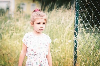 Portrait of happy girl standing outdoors