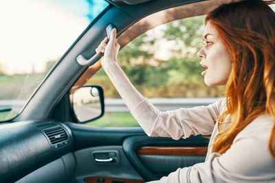 Woman sitting in car