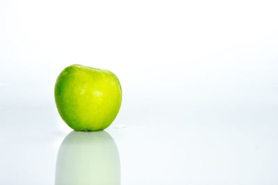 Close-up of apple against white background