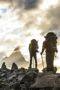 Rear view of two mountaineers hiking towards mt. loki, baffin island.