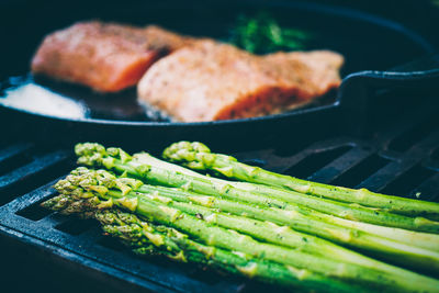 High angle view of meat on barbecue grill