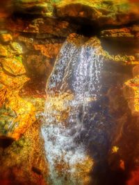 Scenic view of water flowing through rocks