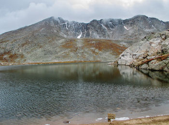 Scenic view of lake against mountain range