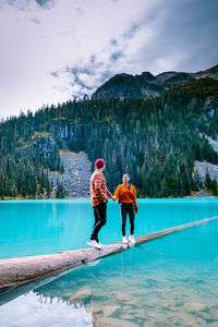 Couple at lake against mountains