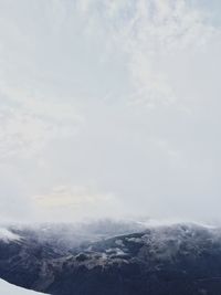 Scenic view of mountains against sky during winter