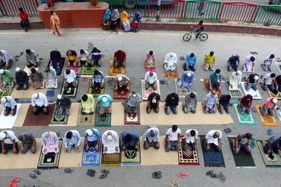 High angle view of people are praying during covid 19