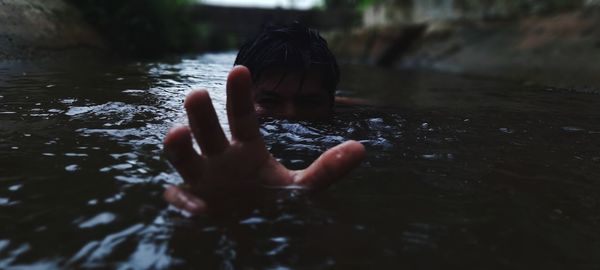 Midsection of person in water