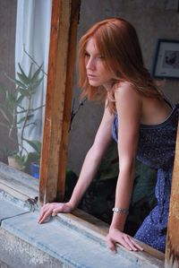 Young woman standing on floor