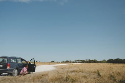 Woman near car