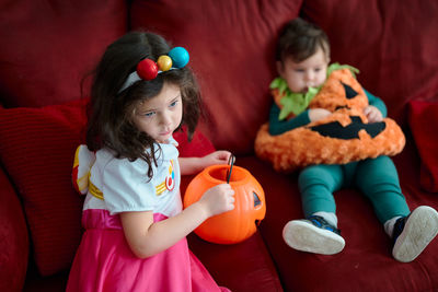 Brother and sister in their halloween costumes