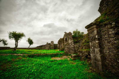 View of old building against cloudy sky