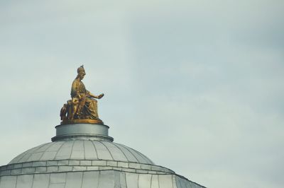 Low angle view of statue against sky