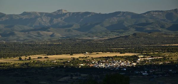 Scenic view of landscape and mountains against sky