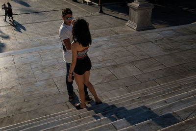 High angle view of people walking on floor