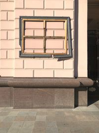 Empty footpath against building