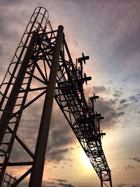 Low angle view of crane against sky