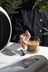 Woman drinking coffee with milk