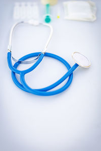 High angle view of stethoscope on white background