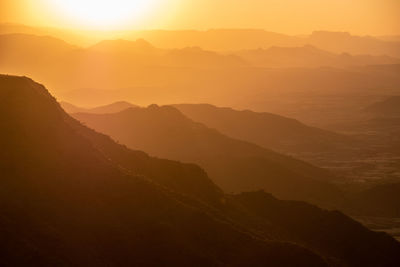 Scenic view of mountains against sky during sunset