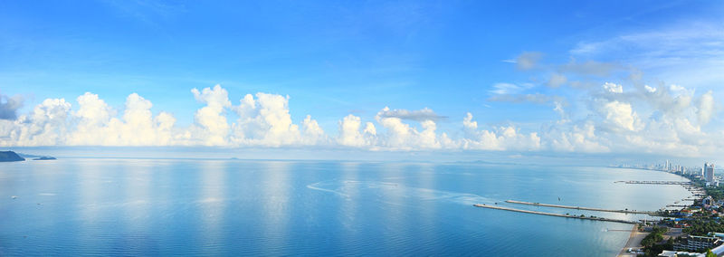 Panoramic view of bay against blue sky