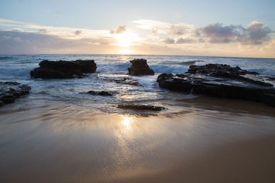 Scenic view of sea against sky during sunset