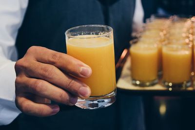 Close-up of man holding drink