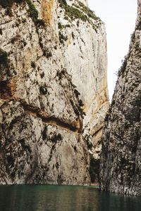 Scenic view of rock formation and sea against sky