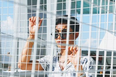 Woman looking through window