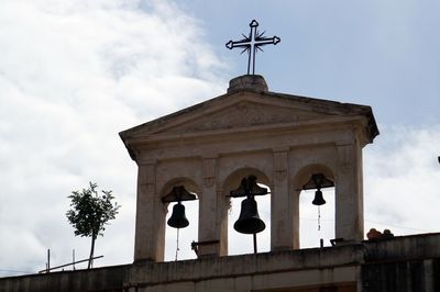 Low angle view of statue against sky